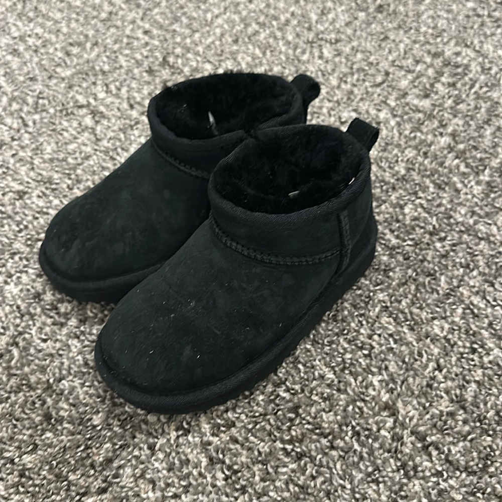 Toddler short black Uggs with zipper.